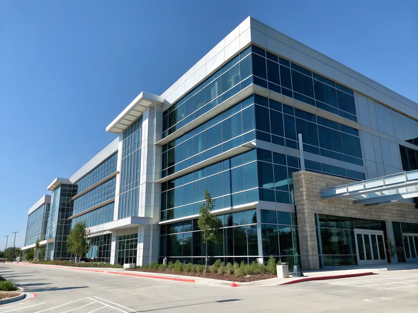A modern office building with glass windows, representing commercial businesses.