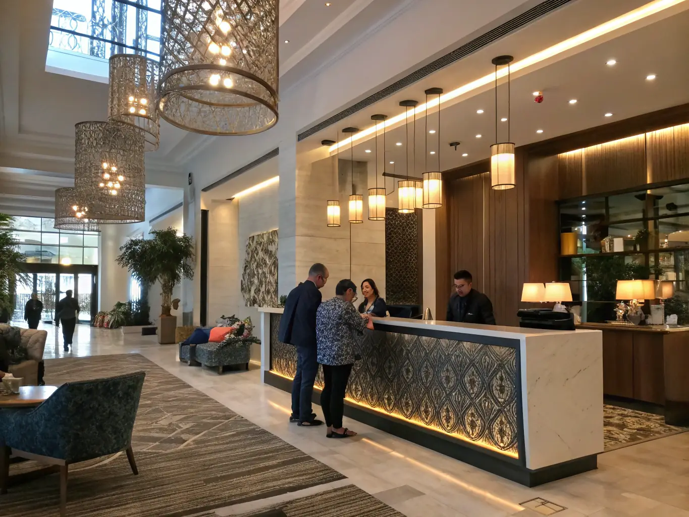 A hotel lobby scene showing guests easily connecting to the Wi-Fi on their devices, emphasizing the convenience and reliability of the guest Wi-Fi system.